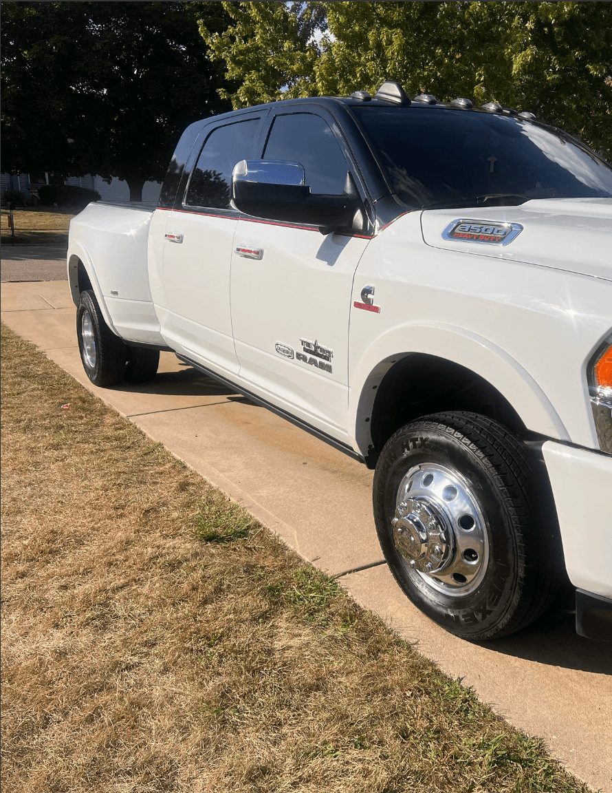 White Ram 3500 dually truck after exterior detail with polished chrome wheels