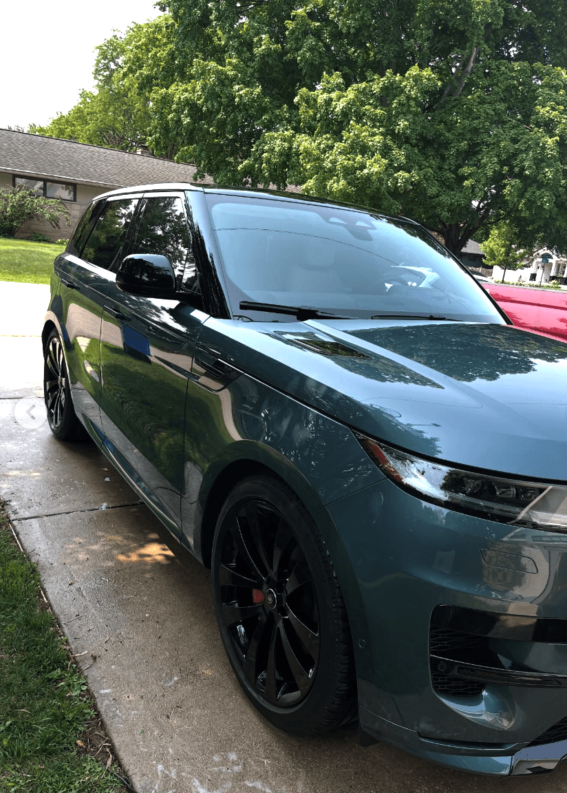 Dark green Range Rover Sport front view after full exterior detail with glossy paint